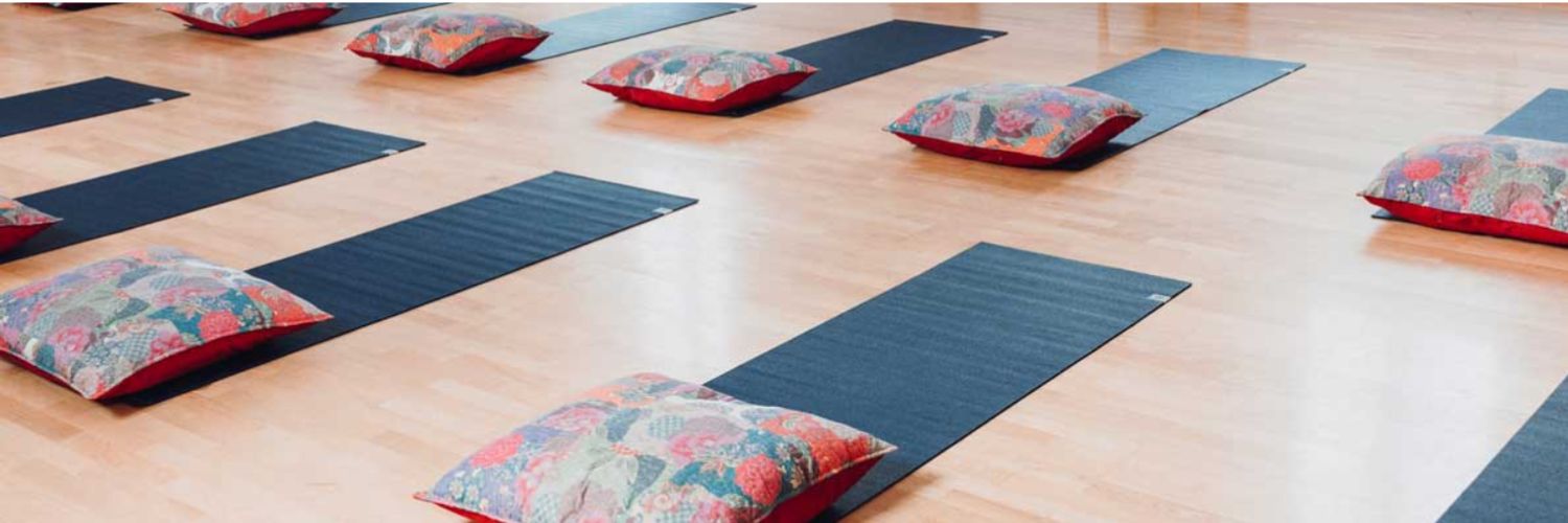 Yoga mats and cushions prepared for a sound relaxation session